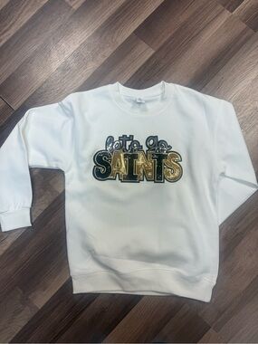 White Sweatshirt with Gold 'Saints' Graphic